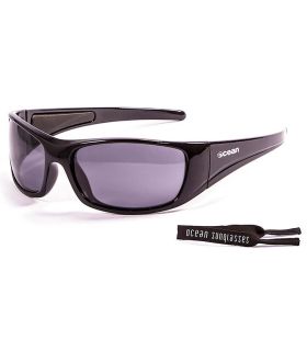 Gafas de sol Ocean Bermuda Shiny Black Smoke con patillas flotantes de policarbonato para deportes acuáticos.