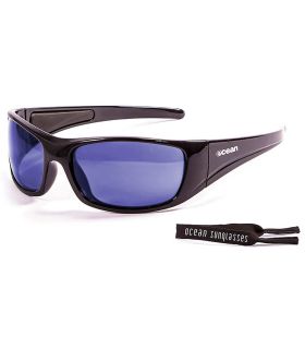 Gafas de sol Ocean Bermuda Shiny Black, lentes Revo Blue y montura flotante de policarbonato para deportes acuáticos.