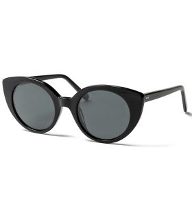 Gafas de sol polarizadas Ocean Greta para mujer con montura negra brillante y lentes ahumadas.